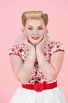 Elegant female portrait with classic pin-up make up. Young woman with surprised excited happy. Cheerful girl with funny face