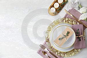 Elegant festive table setting on light background. Space for text