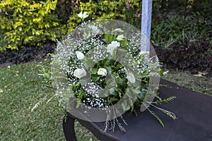 Elegant floral arrangement on table in the garden with banquet and civil wedding service