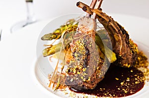 Elegant food photo of ribs served on white plate