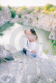 Elegant gentle stylish groom and bride near river or lake