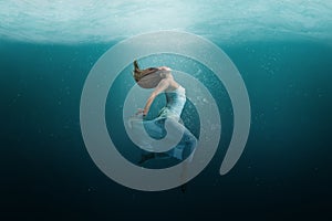 Dancer underwater in a state of peaceful levitation photo