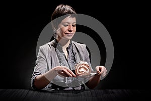 Elegant girl eating a chocolate cake