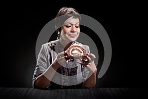 Elegant girl eating a chocolate cake