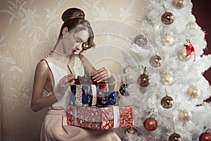 Elegant girl with xmas gifts