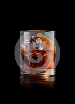 elegant glass of Bourbon Old Fashioned, on black background