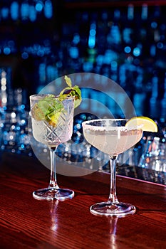 elegant glasses of tasty cocktails with
