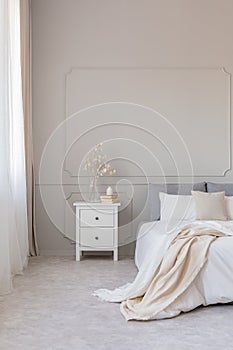 Elegant grey bedroom with copy space on empty wall