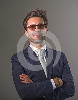 Elegant and handsome happy man in suit posing for company corporate business portrait relaxed and confident smiling happy isolated