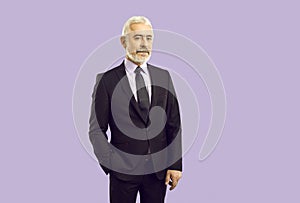 Elegant handsome senior businessman in classic suit isolated on purple background