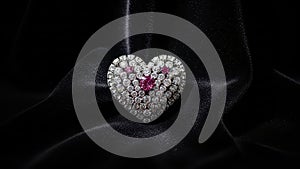 Elegant heart-shaped diamond ring with ruby accent