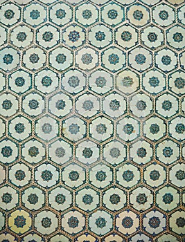 Elegant historical ceramic tiles on the floor and walls of the building.