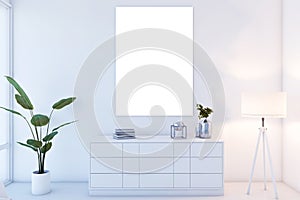 Elegant home decor with white blank canvas ready for art, plant, and lamp.