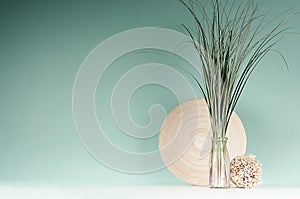 Elegant interior with natural beige decoration in eco style - decorative round sheaf of twigs, bamboo plate, bouquet of cane.