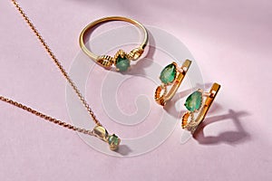 Elegant jewelry set. Jewellery set with gemstones. Product still life concept. Ring, necklace and earrings
