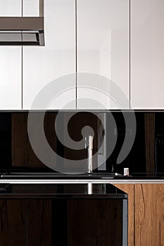 Elegant kitchen with black backsplash