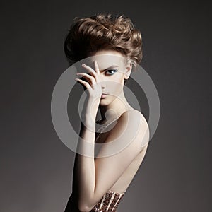 Elegant lady with art makeup and with fashionable haircut