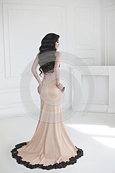 Elegant lady in dress. Beautiful fashion brunette woman in prom