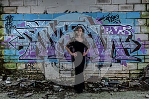 Elegant Lady with Graffiti Wall in Derelict Building