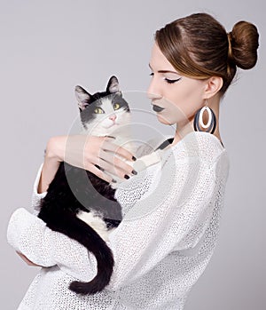 Elegant lady holding cat