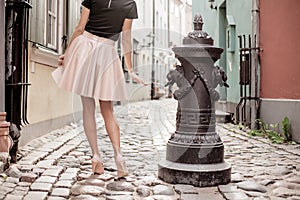 Elegant lady walking in old town