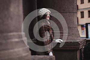 Elegant lady in winter hat and coat