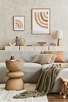 Elegant living room interior design with mock up poster frame, grey corner sofa, coffee table and personal accessories. Pastel.