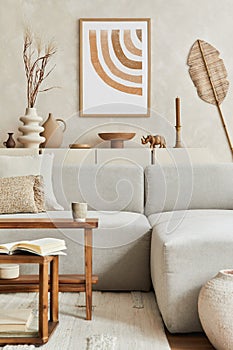 Elegant living room interior design with mock up poster frame, grey corner sofa, coffee table and personal accessories. Pastel.