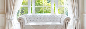 Elegant Living Room with Tufted Sofa and Luxurious Window Serene bright living room tufted white sofa elegant curtains photo