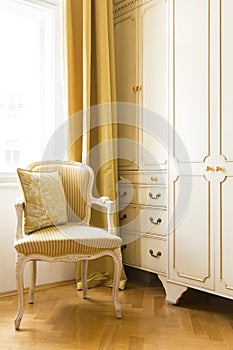 Elegant luxury home interior with parquet wood floors, silk draperies and beautiful furniture