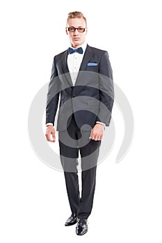 Elegant male model wearing suit and bowtie