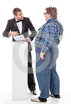 Elegant man arguing with a country yokel