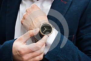 Elegant man in blue suit, business man`s hand with fashion no br