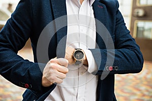 Elegant man in blue suit, business man`s hand with fashion no br