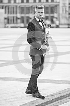 elegant man bridegroom in tuxedo. bridegroom wearing tuxedo bowtie outdoor. grizzle bridegroom