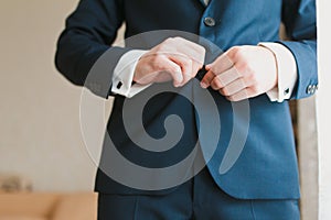 Elegant man dressing up photo