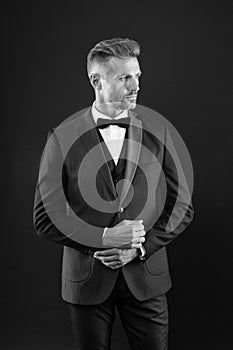 Elegant man in formal outfit. handsome event manager. tuxedo man on black background. perfect male. fashion and beauty