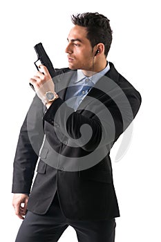 Elegant man with gun, dressed as a spy or secret