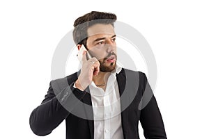 Elegant man is talking on the phone. bearded person wears black