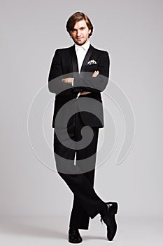 Elegant man in tuxedo full body shot