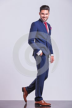 Elegant man walking away whith hand in pocket