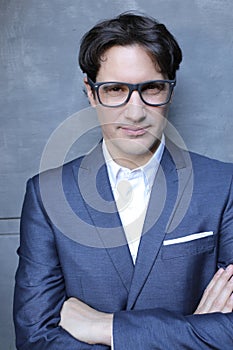 Elegant man wearing suit, bowtie and eyeglasses