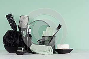 Elegant men dressing table in trend green mint menthe color - black razor, bath puff, toothbrush, tool, mirror, soap, towel.