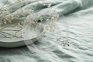 Elegant mint linen placemats with dried flowers