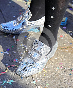 elegant moccasins made with thousands of micro-mirrors for a party  and carnival confetti on the ground in Venice