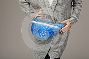 Elegant model with a fanny pack. Closeup picture