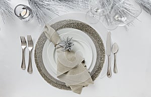 Elegant New Year`s Eve or Christmas holiday place setting. Fine dining table decor.