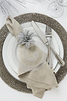 Elegant New Year`s Eve or Christmas holiday place setting. Fine dining table decor.
