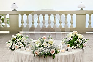Elegant outdoor wedding table with flowers photo