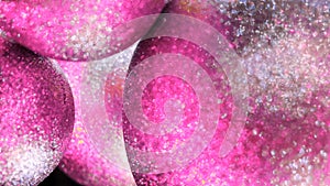Elegant pink and grey Christmas tree toys, festive background, winter holidays. Concept. Close up of colorful swaying